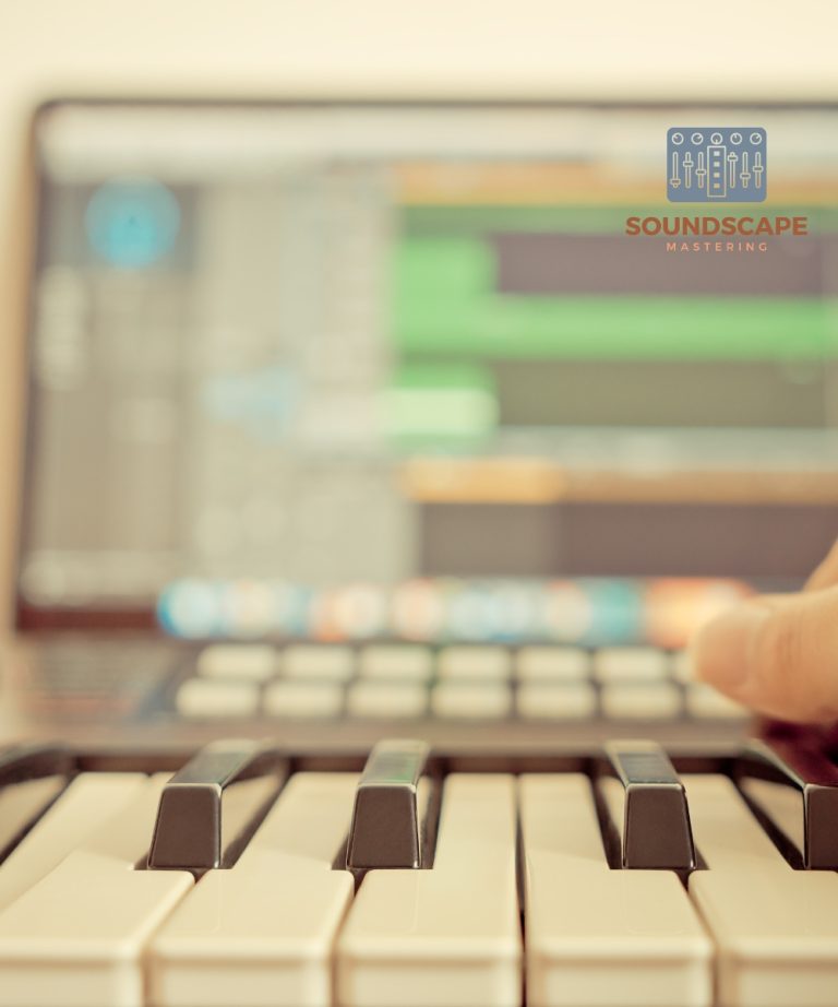 Music studio keyboard and computer DAW in the background